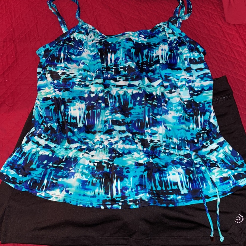 Swim suit: spaghettini strap top and skirt/shorts with side slit.